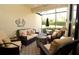 Screened lanai with comfortable wicker seating and outdoor views at 6740 Willowshire Way, Bradenton, FL 34212