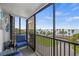 Cozy balcony seating with a lovely ocean view, perfect for relaxing and enjoying the coastal scenery at 707 S Gulfstream Ave # 501, Sarasota, FL 34236