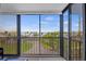 Balcony view overlooking water and palm trees at 707 S Gulfstream Ave # 501, Sarasota, FL 34236