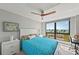 Bright bedroom with a large window view of the waterfront, allowing for ample natural light and scenic views at 707 S Gulfstream Ave # 501, Sarasota, FL 34236