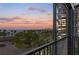 Balcony view of bay and downtown skyline with beautiful sunset and palm trees at 707 S Gulfstream Ave # 501, Sarasota, FL 34236