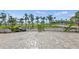 Paver ground-level patio area overlooks the grounds, ocean and palm trees at 707 S Gulfstream Ave # 501, Sarasota, FL 34236