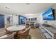 Common area with table, chairs, multiple TVs and comfortable seating at 707 S Gulfstream Ave # 501, Sarasota, FL 34236
