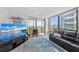 A modern living room leading to a balcony with city views at 707 S Gulfstream Ave # 501, Sarasota, FL 34236