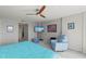 Bright and airy primary bedroom with water view, ceiling fan, and stylish decor at 707 S Gulfstream Ave # 501, Sarasota, FL 34236
