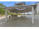 Well-appointed outdoor grilling and dining area under a gazebo by the pool at 707 S Gulfstream Ave # 501, Sarasota, FL 34236