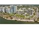 Picturesque waterfront featuring luxurious high-rise condos and lush greenery with palm trees at 707 S Gulfstream Ave # 501, Sarasota, FL 34236