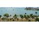 Scenic waterfront view with palm trees and sailboats, creating a picturesque and inviting coastal ambiance at 707 S Gulfstream Ave # 501, Sarasota, FL 34236