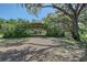 Exterior of a large, open-sided barn structure in a wooded area at 7200 Chameleon Way, Sarasota, FL 34241