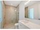 Contemporary bathroom featuring a glass shower, sleek vanity, and neutral tile at 7200 Chameleon Way, Sarasota, FL 34241