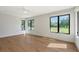Inviting bedroom with bright windows and wood flooring, creating a relaxing atmosphere at 7200 Chameleon Way, Sarasota, FL 34241