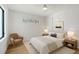Cozy bedroom featuring a comfortable bed, soft lighting from bedside lamps, and a calming, neutral color palette at 7200 Chameleon Way, Sarasota, FL 34241