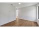 Open bedroom with hardwood floors, neutral walls, and bright, airy feel at 7200 Chameleon Way, Sarasota, FL 34241