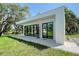 Modern building exterior with large windows, surrounded by trees at 7200 Chameleon Way, Sarasota, FL 34241