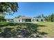 Modern home exterior with a minimalist design and large windows at 7200 Chameleon Way, Sarasota, FL 34241