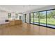 A well-lit kitchen and living space offer a blend of modern design and inviting views at 7200 Chameleon Way, Sarasota, FL 34241