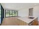 Bright, open kitchen featuring a large island, stainless steel appliances, and scenic outdoor views at 7200 Chameleon Way, Sarasota, FL 34241