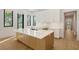 Elegant kitchen showcasing an island with white countertop and modern cabinetry at 7200 Chameleon Way, Sarasota, FL 34241