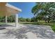 Spacious patio perfect for entertaining guests with a view of the beautiful backyard at 7200 Chameleon Way, Sarasota, FL 34241