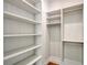 Well-organized walk-in closet with custom shelving and ample storage space at 7200 Chameleon Way, Sarasota, FL 34241