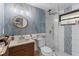 Stylish bathroom with marble wall, glass shower, modern fixtures, and ample counter space at 7795 Wright Ave, Sarasota, FL 34231