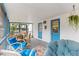 Inviting screened porch featuring comfortable seating and a dining table, perfect for relaxing and entertaining at 7795 Wright Ave, Sarasota, FL 34231