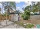 Quaint backyard shed with a rustic design, providing extra storage and adding charm to the landscape at 7795 Wright Ave, Sarasota, FL 34231