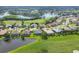 Aerial view of homes and a lake at 8718 Grey Oaks Ave, Sarasota, FL 34238