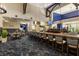 Stylish bar area with comfortable seating, a well-stocked bar, and multiple TVs, ideal for socializing and entertainment at 8718 Grey Oaks Ave, Sarasota, FL 34238