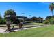 Outdoor bocce ball court with covered seating and well-maintained green space in a resort-style community at 8718 Grey Oaks Ave, Sarasota, FL 34238