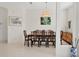 Traditional dining room featuring a large dining table and unique decor at 8718 Grey Oaks Ave, Sarasota, FL 34238