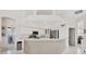 Bright kitchen featuring stainless appliances, light countertops, and white cabinets at 8718 Grey Oaks Ave, Sarasota, FL 34238