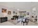 Bright living room with access to the pool area via sliding glass doors at 8718 Grey Oaks Ave, Sarasota, FL 34238