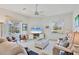 Bright living room featuring comfortable seating and a view of the pool area at 8718 Grey Oaks Ave, Sarasota, FL 34238