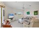 Comfortable living room with a large flat-screen TV and plenty of seating at 8718 Grey Oaks Ave, Sarasota, FL 34238