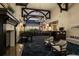 Inviting lobby with a fireplace, piano, bar area, and comfortable seating, perfect for relaxation and socializing at 8718 Grey Oaks Ave, Sarasota, FL 34238