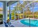 Enclosed lanai with a refreshing pool, perfect for relaxing and entertaining with great views at 8718 Grey Oaks Ave, Sarasota, FL 34238