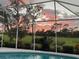 Gorgeous evening sky over the pool and the golf course at 8718 Grey Oaks Ave, Sarasota, FL 34238