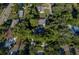 Aerial view of the property, nestled among mature trees, providing a private and serene setting at 95 S Briggs Ave, Sarasota, FL 34237