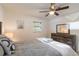 Cozy bedroom offers a spacious layout, a dresser, and a well-lit interior at 95 S Briggs Ave, Sarasota, FL 34237