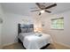 Inviting bedroom with neutral colors, a ceiling fan, and bright windows showcases a calming and comfortable space at 95 S Briggs Ave, Sarasota, FL 34237
