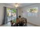Cozy dining area features sliding glass doors to the backyard, and tile floors for a clean and modern aesthetic at 95 S Briggs Ave, Sarasota, FL 34237