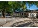 Inviting single-story home features a well-maintained lawn, covered porch, and an attached two-car garage at 95 S Briggs Ave, Sarasota, FL 34237