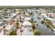 Aerial view of a waterfront community showcasing single-Gathering homes with boat docks and easy access to the open water at 10308 Kingfisher W Rd, Bradenton, FL 34209