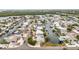 Wide aerial shot capturing a waterfront neighborhood with canals, boat docks, and a variety of single Gathering homes at 10308 Kingfisher W Rd, Bradenton, FL 34209