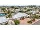 Beautiful waterfront home with a metal roof and a paved driveway in a coastal community at 10308 Kingfisher W Rd, Bradenton, FL 34209