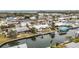 Overhead shot showcasing a waterfront neighborhood featuring homes with boat docks and easy access to open water channels at 10308 Kingfisher W Rd, Bradenton, FL 34209