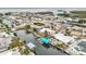 Aerial view showcasing a waterfront neighborhood, highlighting homes with private boat docks and beautiful canal access at 10308 Kingfisher W Rd, Bradenton, FL 34209