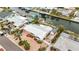 Waterfront home featuring a brick paved driveway, RV parking, lush tropical landscaping and canal access with a boat lift at 10308 Kingfisher W Rd, Bradenton, FL 34209