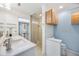 Stylish bathroom featuring double sinks, glass shower, and tasteful decor at 10308 Kingfisher W Rd, Bradenton, FL 34209
